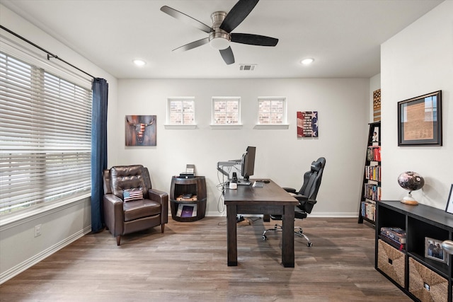 office featuring hardwood / wood-style floors and ceiling fan