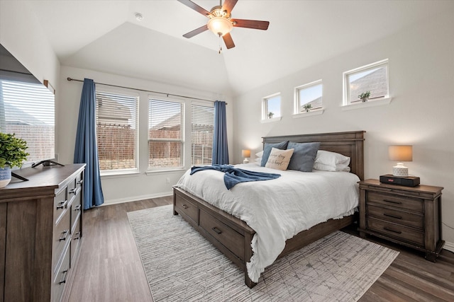 bedroom featuring ceiling fan, vaulted ceiling, and dark hardwood / wood-style flooring