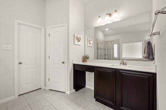 bathroom featuring vanity, tile patterned flooring, and a shower with shower door