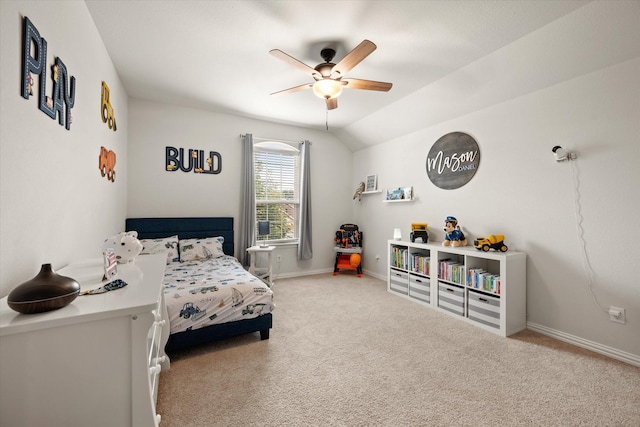 bedroom with ceiling fan, vaulted ceiling, and carpet