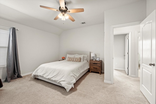 carpeted bedroom with lofted ceiling and ceiling fan