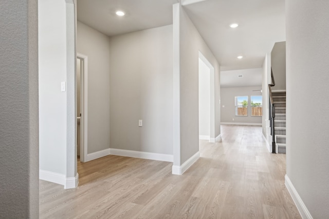 hall with light hardwood / wood-style floors