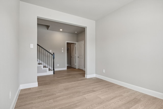 unfurnished room with light hardwood / wood-style floors