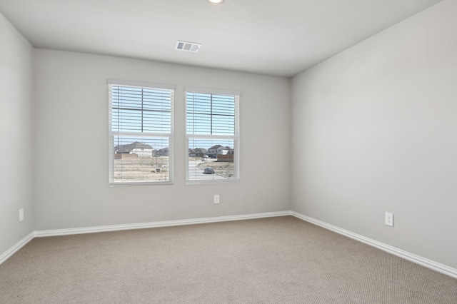 spare room with carpet flooring