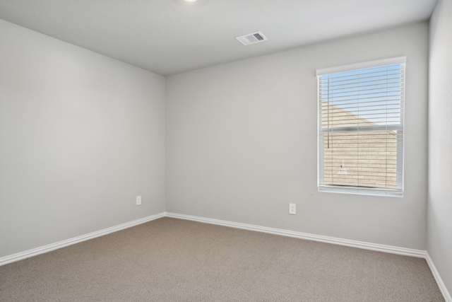 carpeted spare room with plenty of natural light