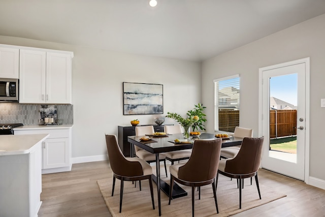 dining area with light wood-type flooring