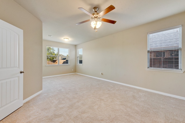 carpeted empty room with ceiling fan