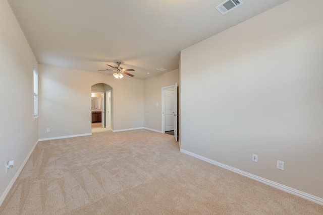 carpeted empty room featuring ceiling fan