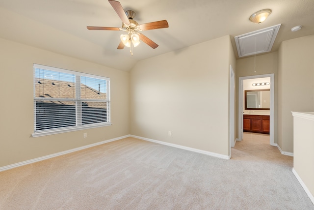 carpeted empty room with ceiling fan and lofted ceiling