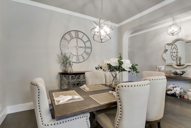 dining area featuring ornamental molding, dark wood-type flooring, and a chandelier