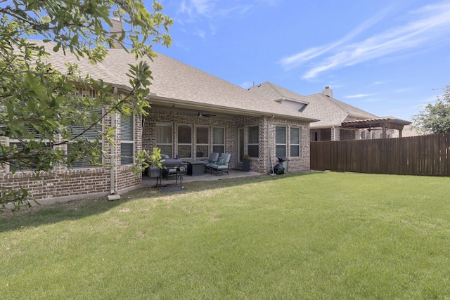 back of house featuring a patio, an outdoor hangout area, and a lawn