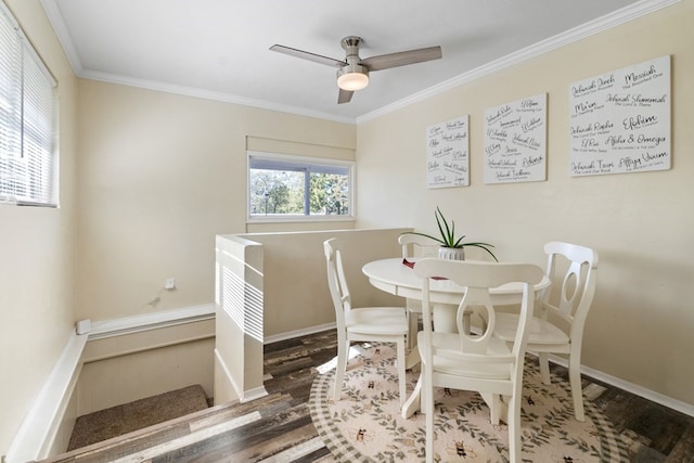 dining room with wood-type flooring, ceiling fan, and ornamental molding