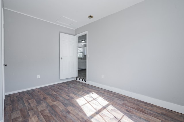 unfurnished room with dark hardwood / wood-style floors