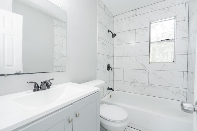 full bathroom with vanity, toilet, and tiled shower / bath