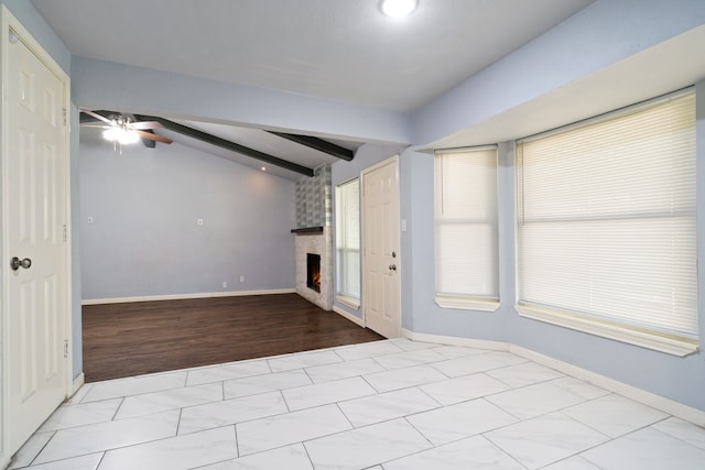 unfurnished living room with a fireplace, vaulted ceiling with beams, light hardwood / wood-style flooring, and ceiling fan