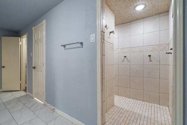 bathroom featuring tiled shower