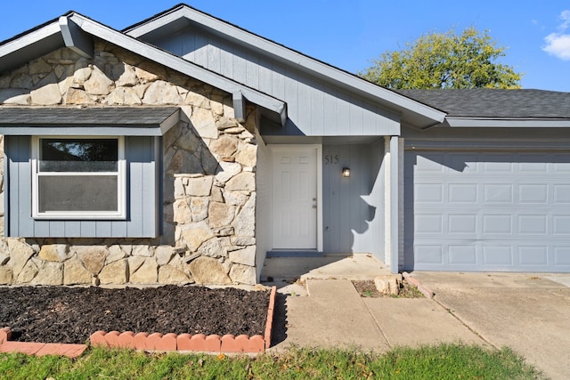 view of exterior entry featuring a garage