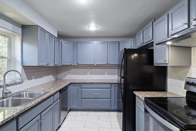 kitchen with decorative backsplash, light stone countertops, sink, dishwasher, and black electric range oven