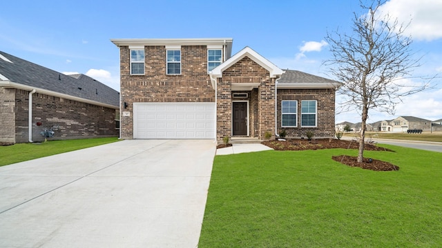 view of front of home featuring a garage and a front yard