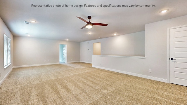 carpeted empty room featuring ceiling fan