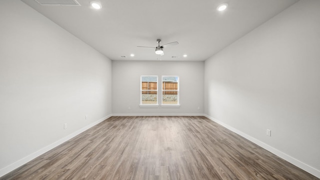 unfurnished room with ceiling fan and hardwood / wood-style floors