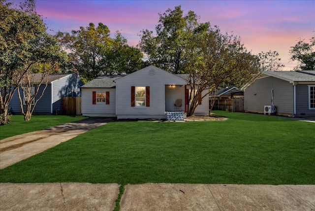 view of front of home with a lawn