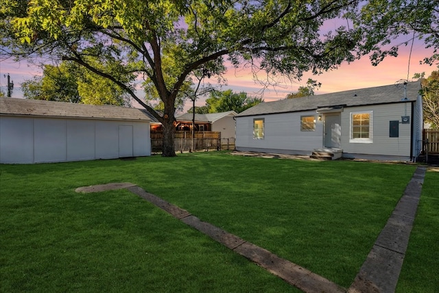 yard at dusk with an outbuilding