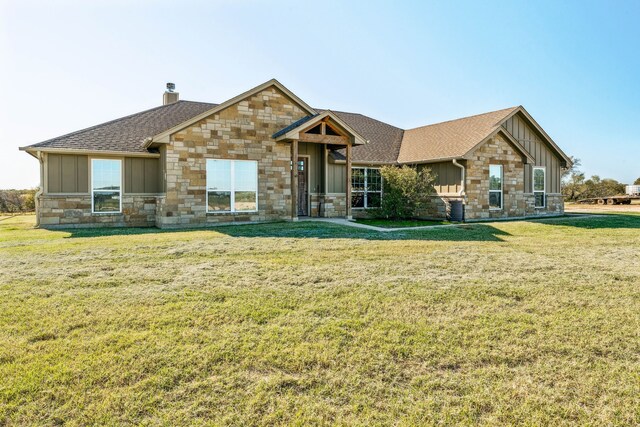 craftsman-style home with a front yard