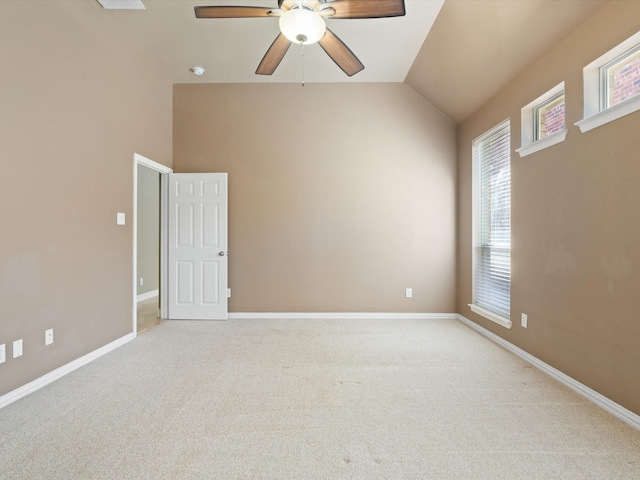 unfurnished room with light colored carpet, ceiling fan, and lofted ceiling