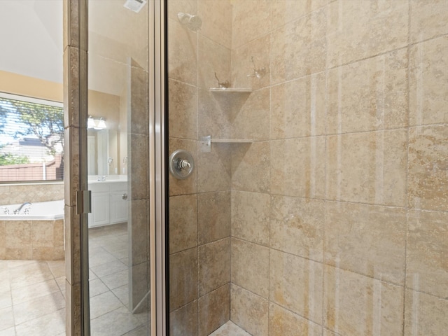 bathroom featuring vanity, tile patterned floors, and independent shower and bath