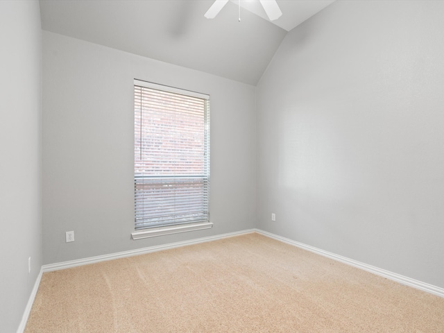 unfurnished room featuring light colored carpet, ceiling fan, and lofted ceiling