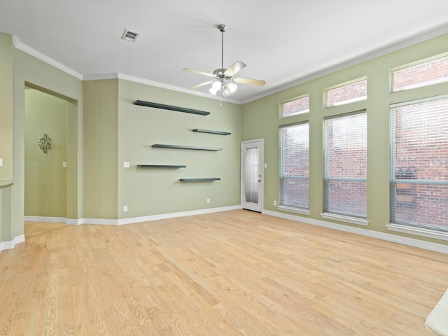 interior space with ceiling fan, light hardwood / wood-style floors, and ornamental molding