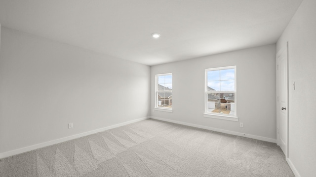 empty room with light colored carpet