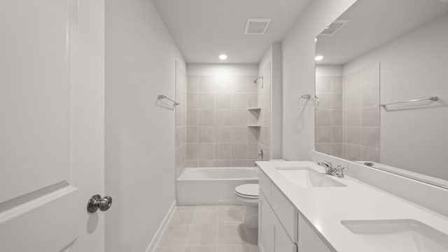 full bathroom with vanity, toilet, tiled shower / bath combo, and tile patterned flooring