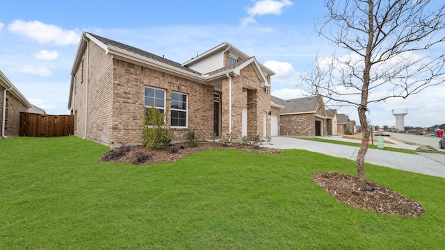 view of front facade featuring a garage and a front yard