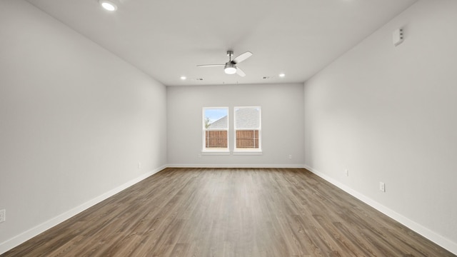 unfurnished room featuring hardwood / wood-style floors and ceiling fan