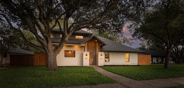 view of front of house with a yard