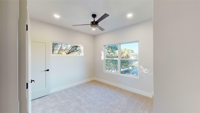 carpeted empty room with ceiling fan