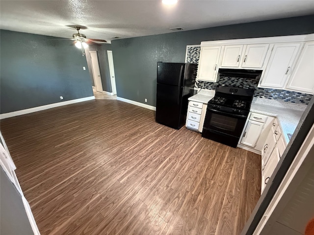 kitchen featuring ceiling fan, dark hardwood / wood-style flooring, decorative backsplash, white cabinets, and black appliances