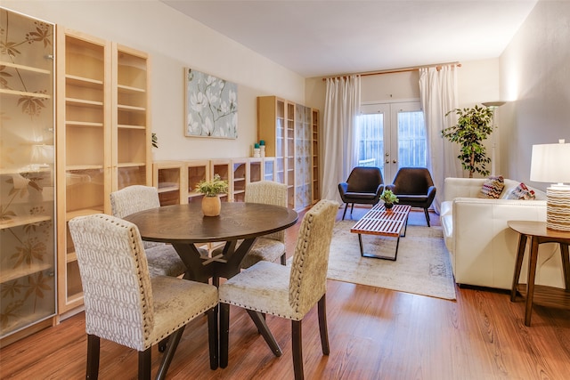 dining area featuring hardwood / wood-style floors and french doors