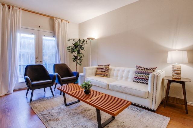 living room with hardwood / wood-style flooring and french doors