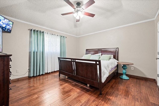 bedroom with hardwood / wood-style floors, a textured ceiling, ceiling fan, and crown molding