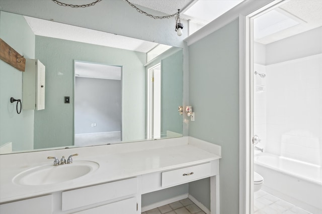 full bathroom featuring washtub / shower combination, tile patterned floors, vanity, and toilet