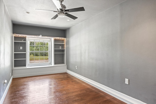 spare room featuring ceiling fan and wood-type flooring