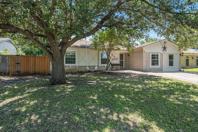 ranch-style house with a front lawn