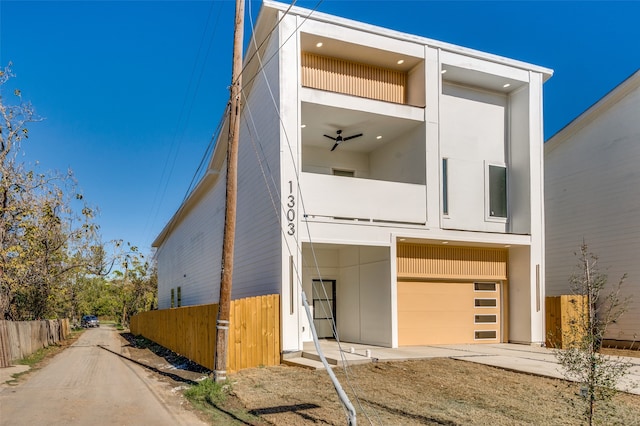 contemporary house with a balcony and a garage