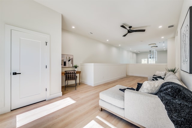 interior space with ceiling fan and light hardwood / wood-style floors