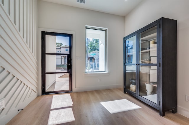 doorway with light wood-type flooring