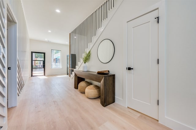 foyer entrance with light wood-type flooring