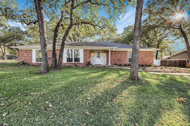 ranch-style house with a front yard